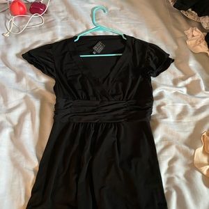 Black V-neck blouse.